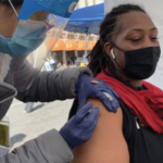 African American women receiving vaccine at GLIDE- San Francisco.
