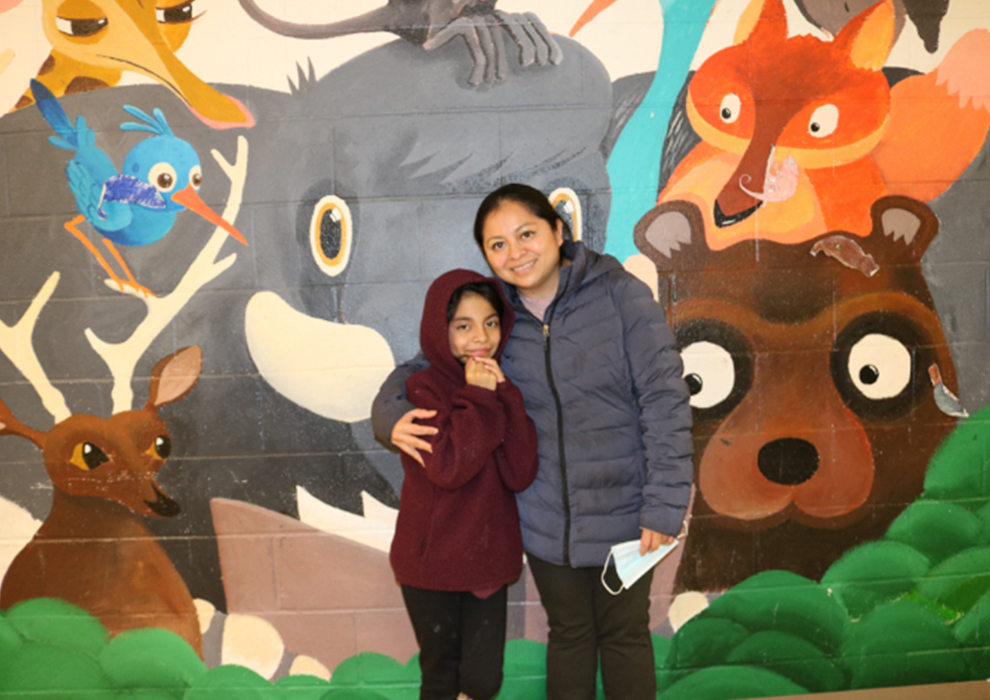 GLIDE client and mother, Landy, picks her daughter up from the afterschool program at FYCC.